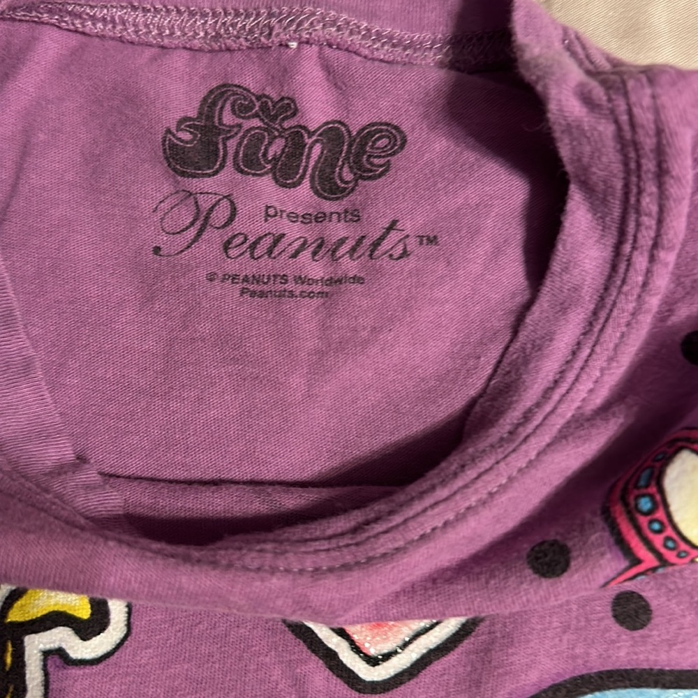2 tee shirts and pair of shorts shirts are size girls medium. Puma and peanuts. - Picture 6 of 11
